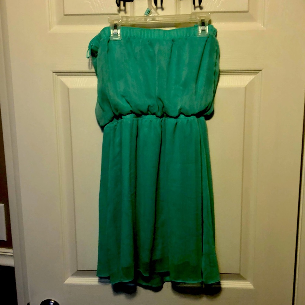 Short green dress.